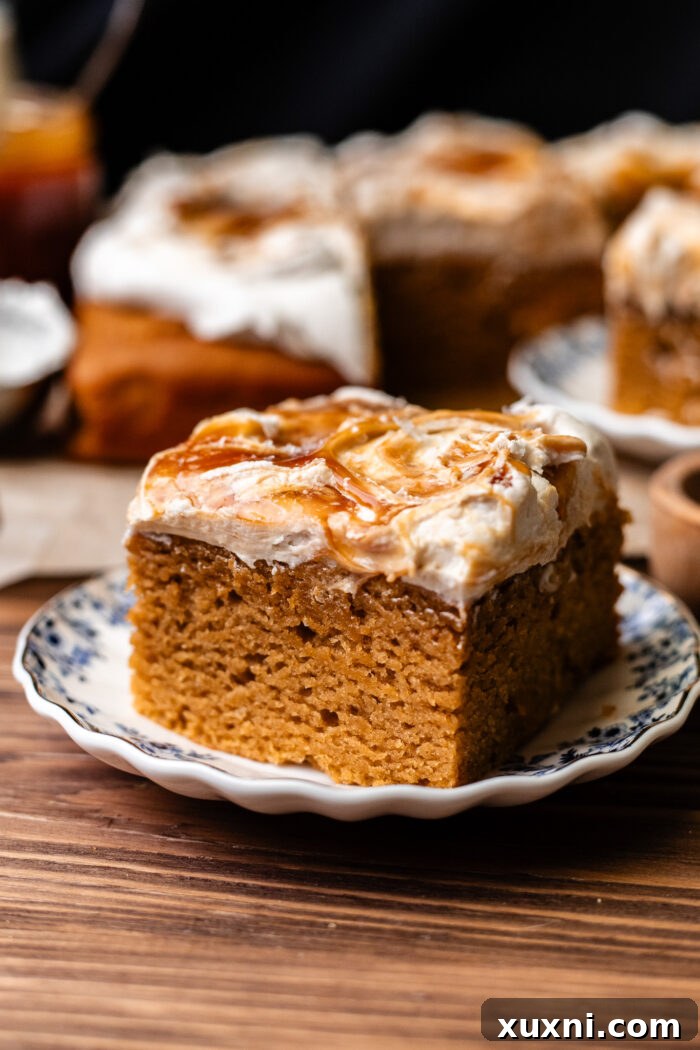 A single, inviting slice of moist vegan sweet potato cake served on a plate.