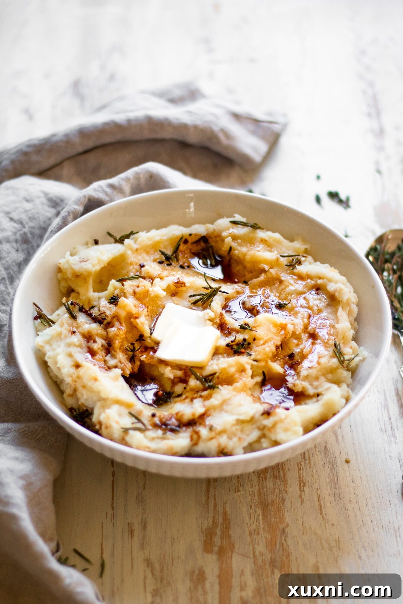 close-up of creamy Paleo mashed potatoes in a serving bowl