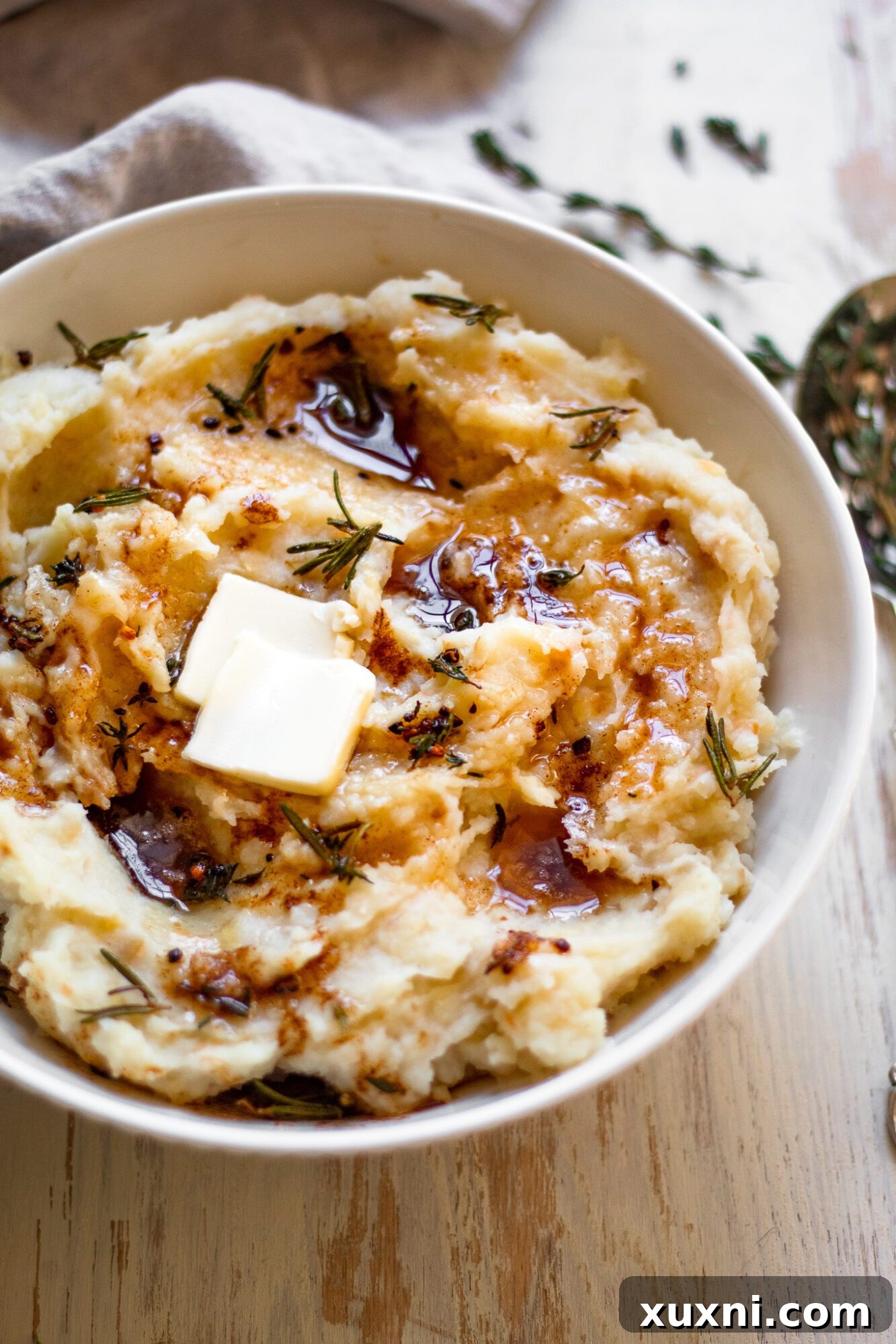 healthy mashed potatoes with rich gravy drizzled over them
