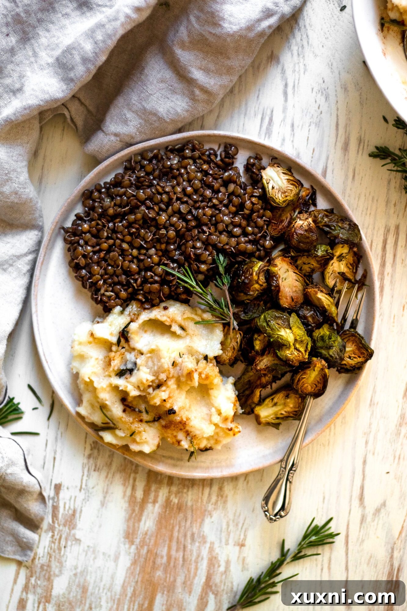 plate of lentils with roasted brussels sprouts, a side dish idea for mashed potatoes