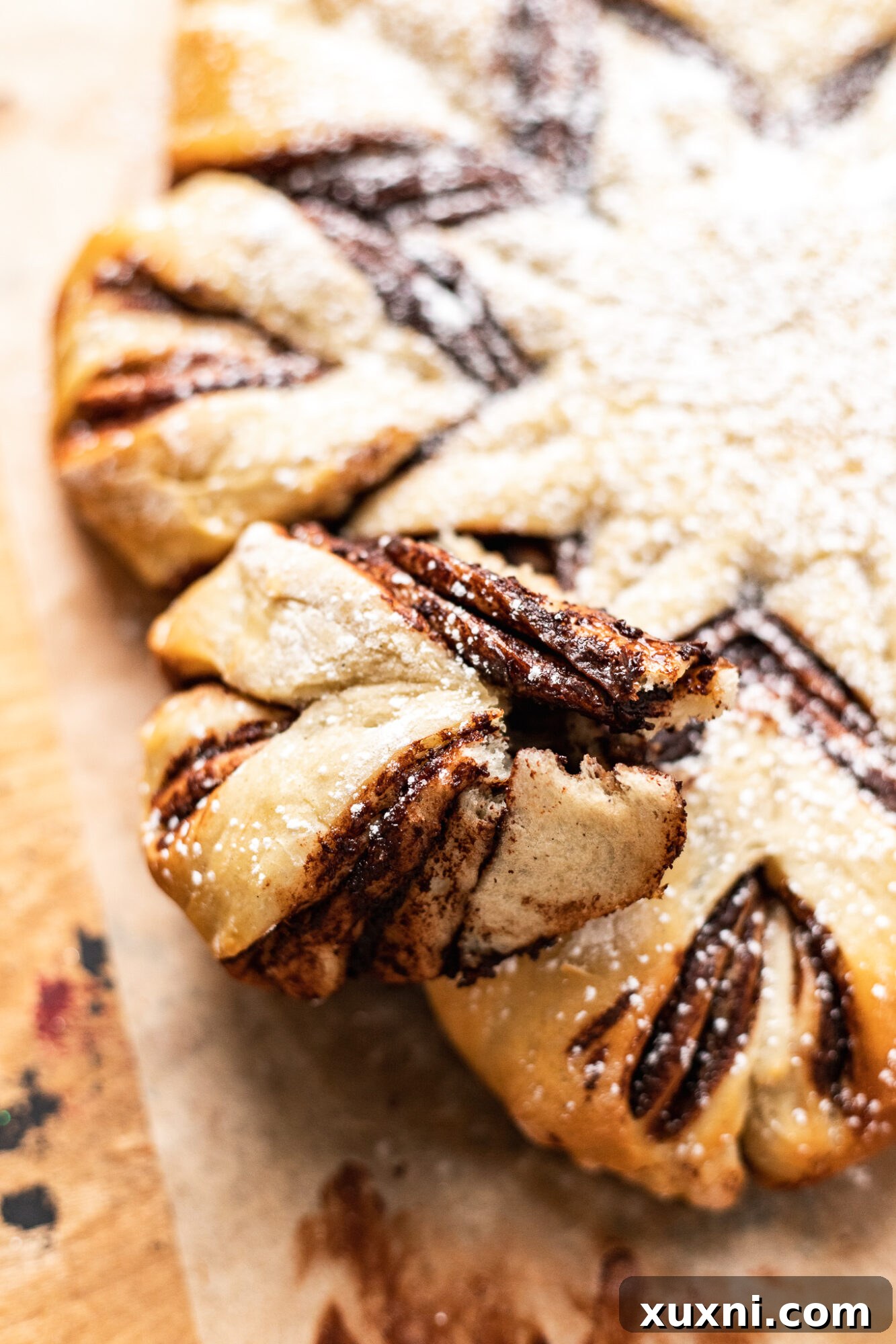 A slice of vegan star bread presented on a plate, showcasing its fluffy texture