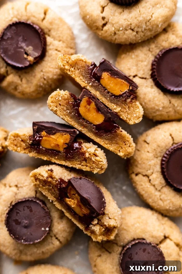 Soft Baked Peanut Butter Cup Cookies (Vegan + Gluten Free) sliced in half