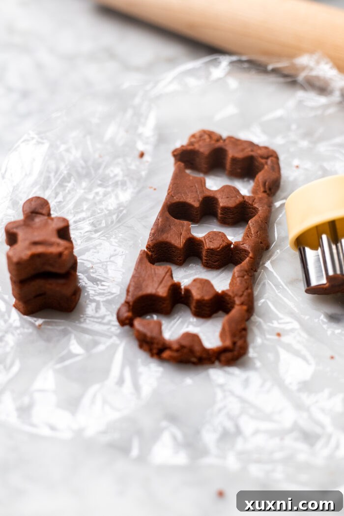 gingerbread cookies being cut out
