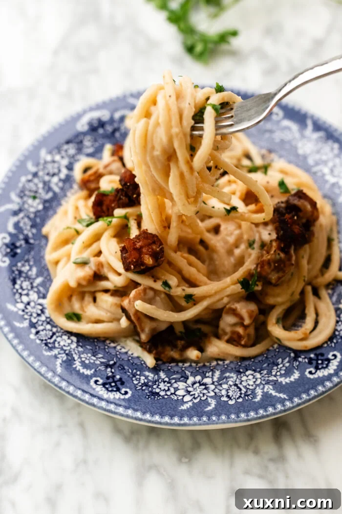 vegan carbonara pasta being eaten