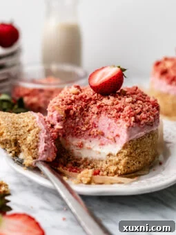 strawberry crunch cheesecake on a plate