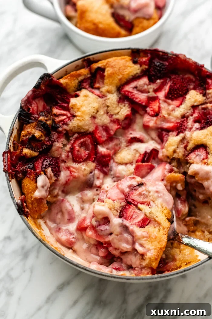Vegan Strawberry Cheesecake Cobbler Recipe for Summer Desserts 3 scooped vegan strawberry cobbler