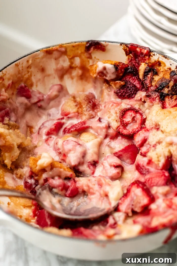 Vegan Strawberry Cheesecake Cobbler Recipe for Summer Desserts 4 scooping the strawberry cobbler
