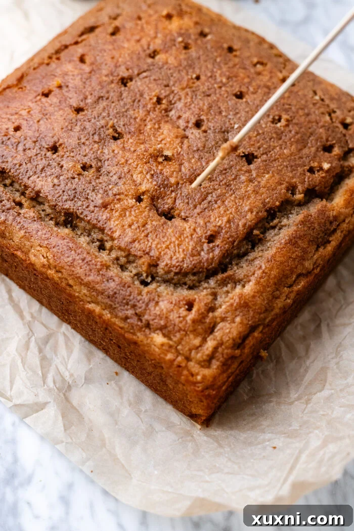 Moist Salted Caramel Latte Cake — Vegan Recipe 6 poking holes into the cake