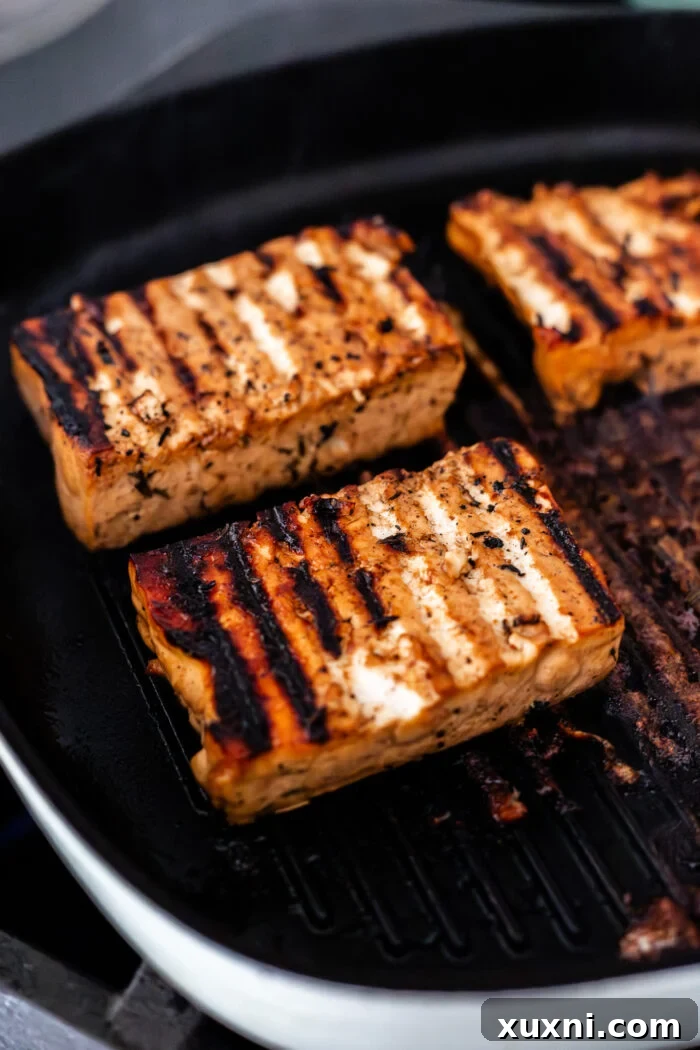 Juicy Grilled Balsamic Marinated Tofu Recipe 7 grilled tofu on a grill plate